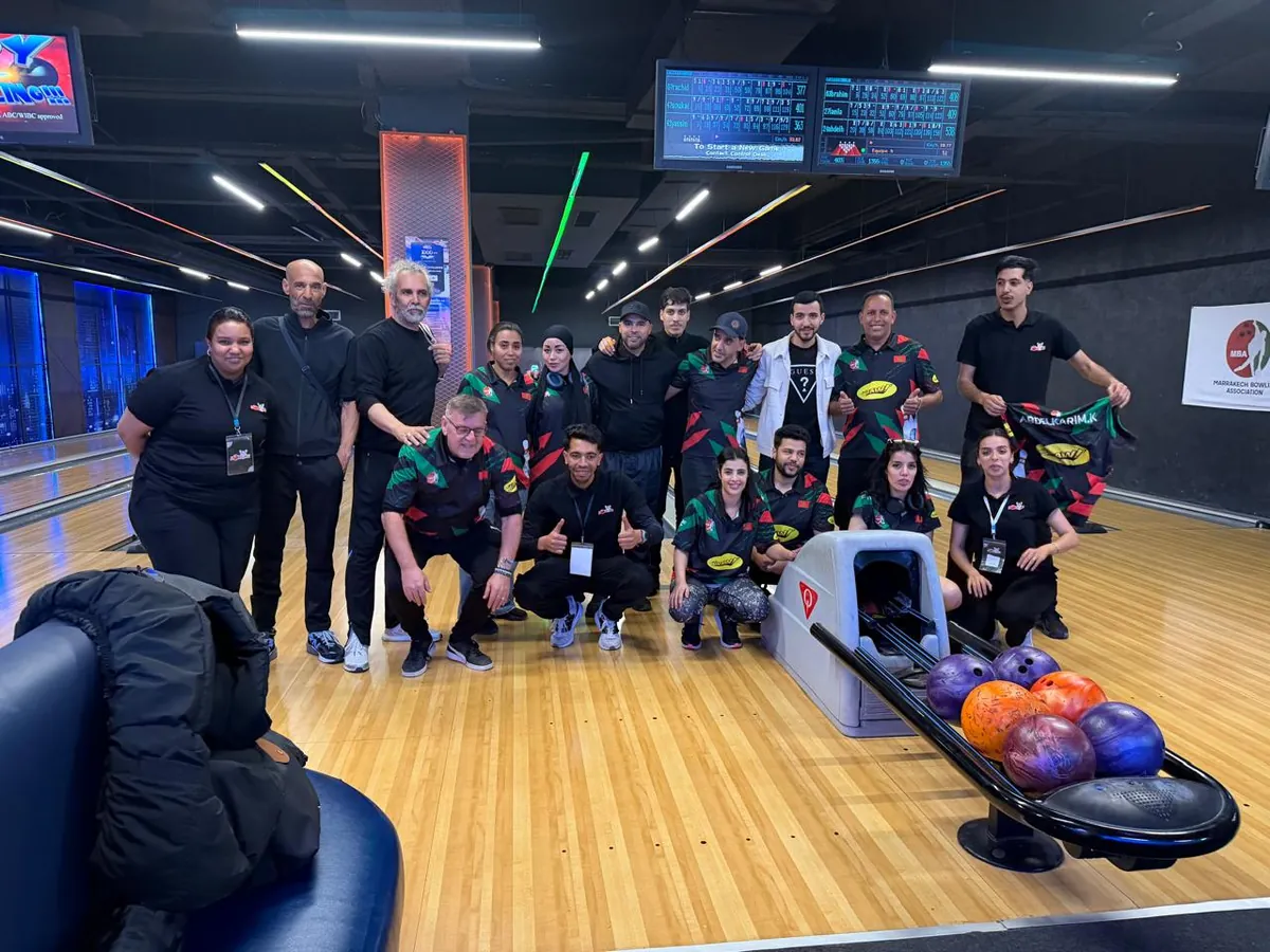 MBA bowlers posing together on a bowling lane