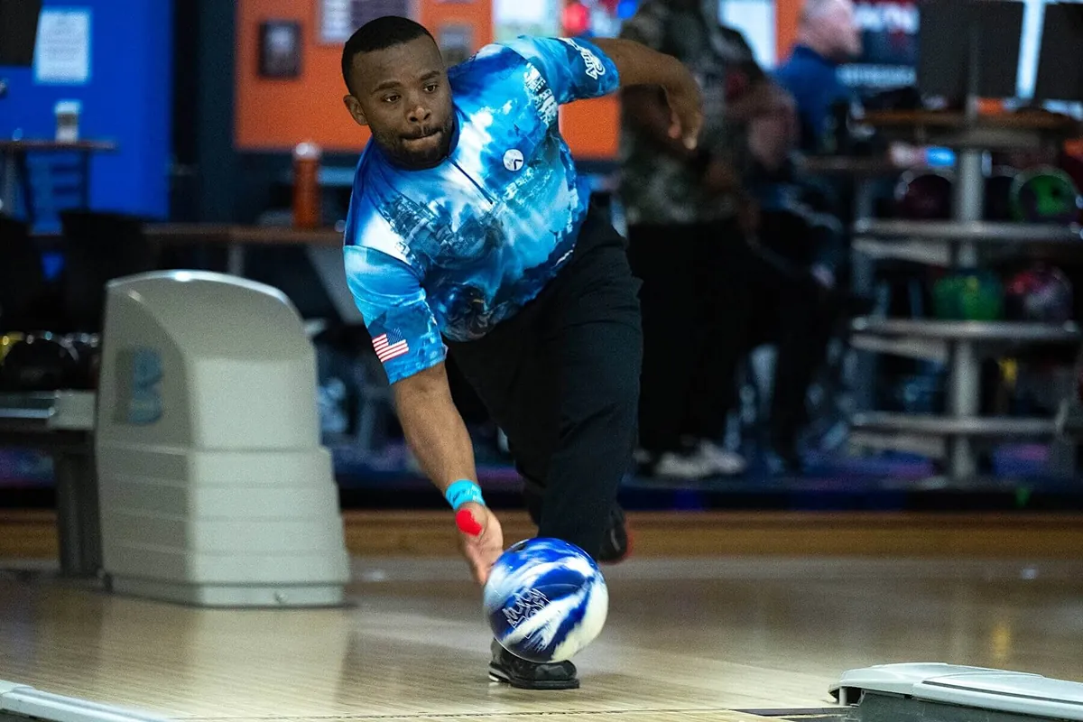 Bowler releasing the ball with rotation, thumb out before the fingers, for a hook shot